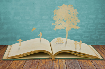 Picture of book with people and trees popping out